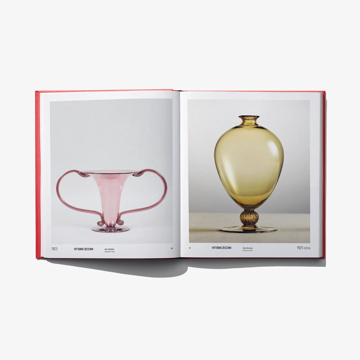 Open book spread showing a pink glass vase and a gold urn-style vase
