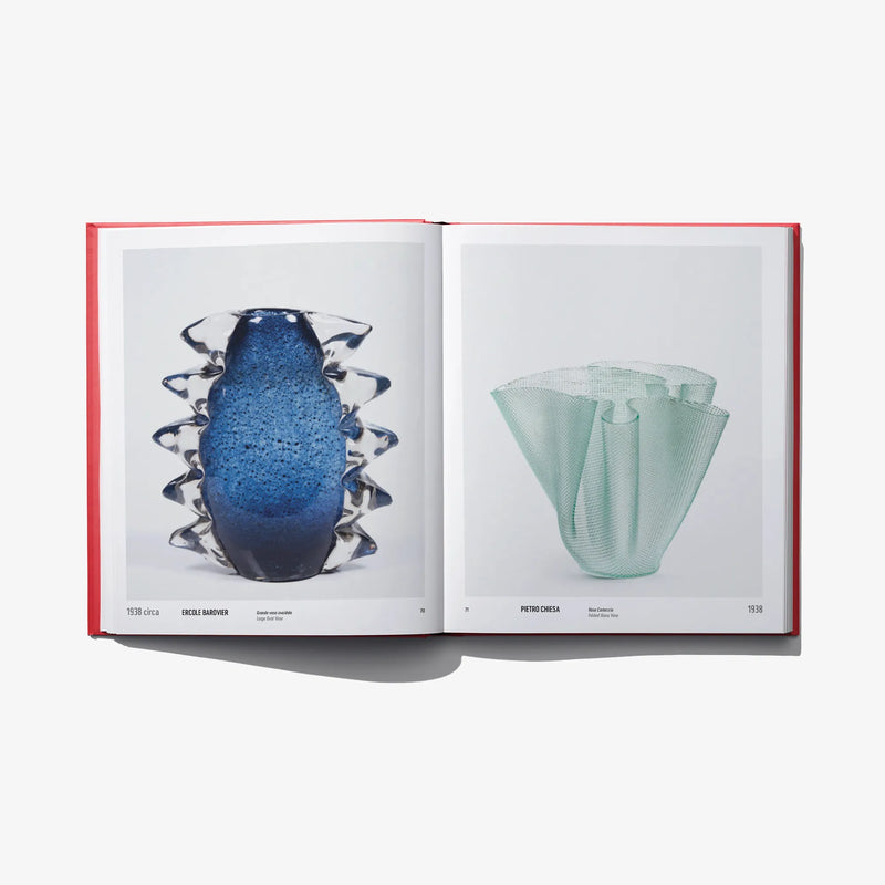 Open design book spread showing a blue glass vase and a mint green vase