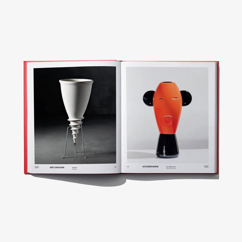 Open book spread with a white pedestal vase on the left and an orange abstract vase