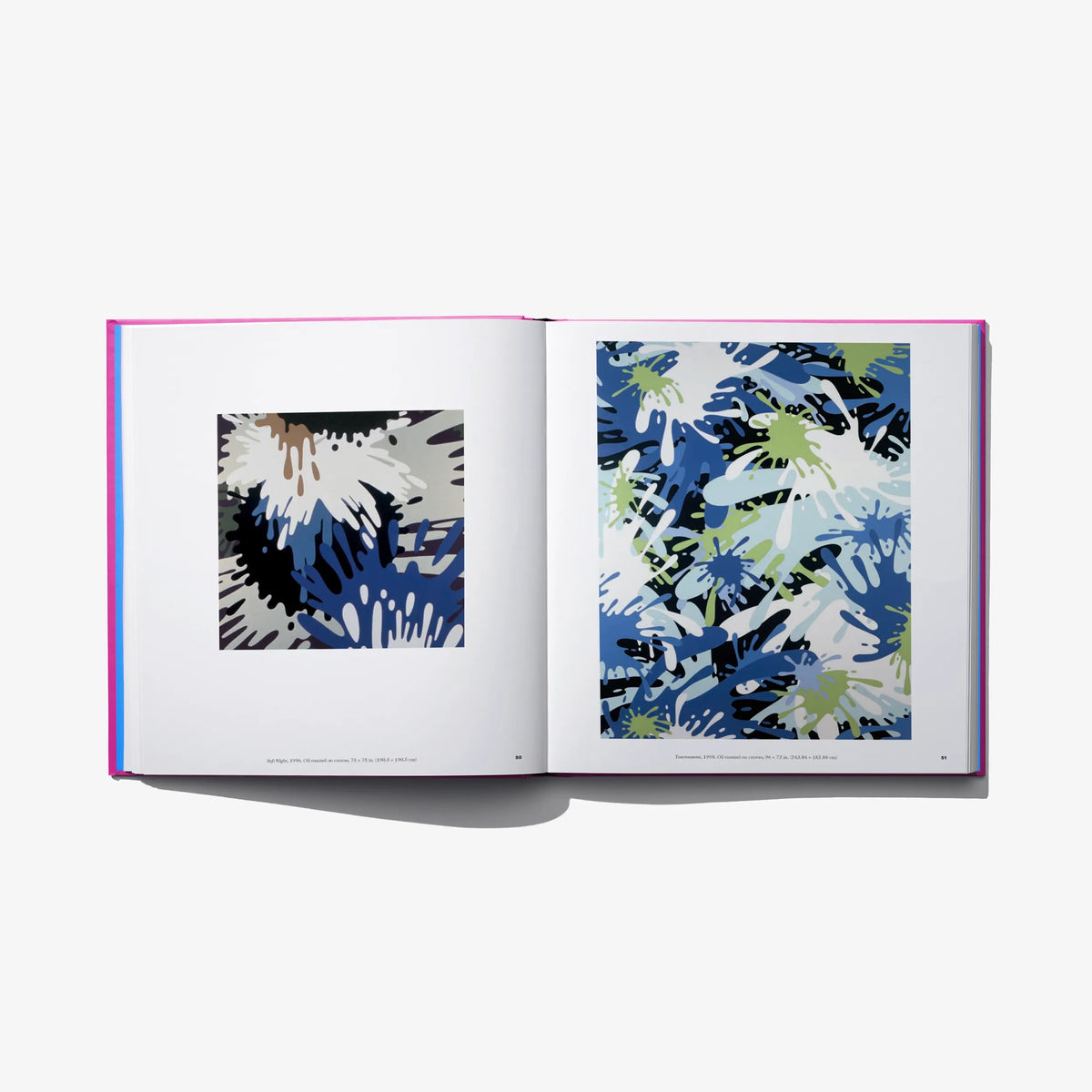Art book open spread with blue and white abstract prints on both pages