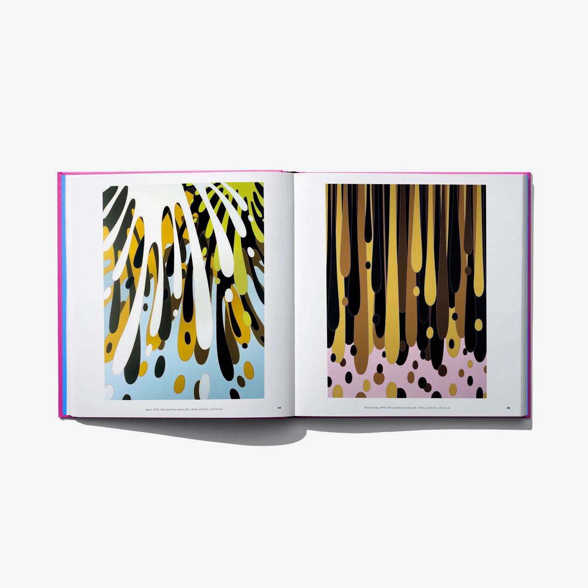 Art book open spread with yellow, black, and brown abstract prints