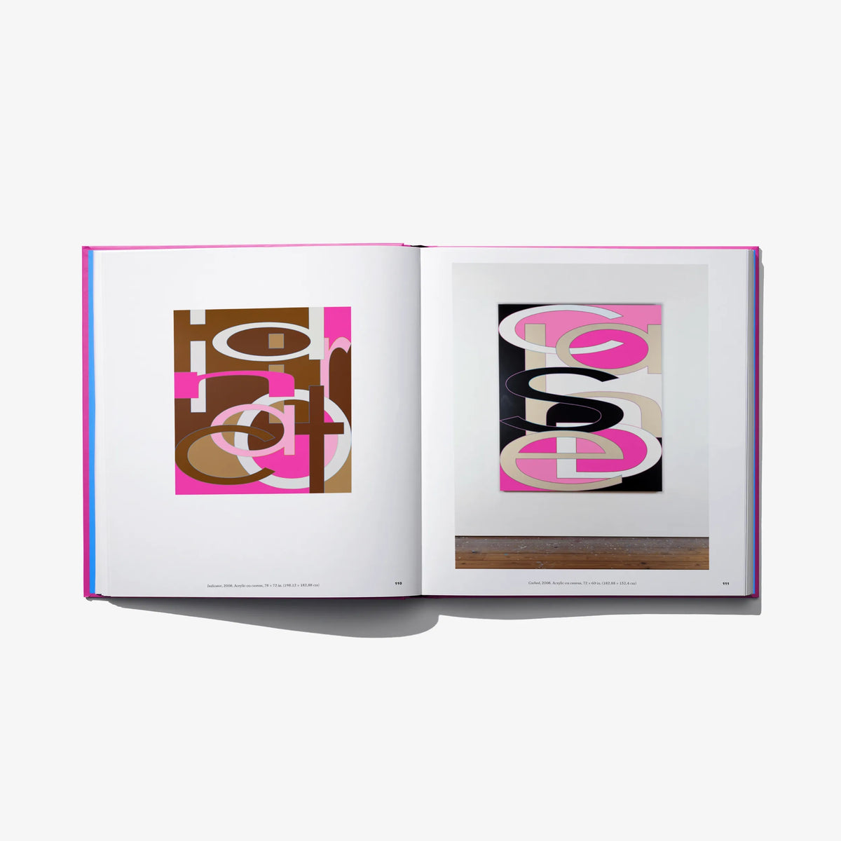 Art book open spread with colorful typographic abstract prints on both pages