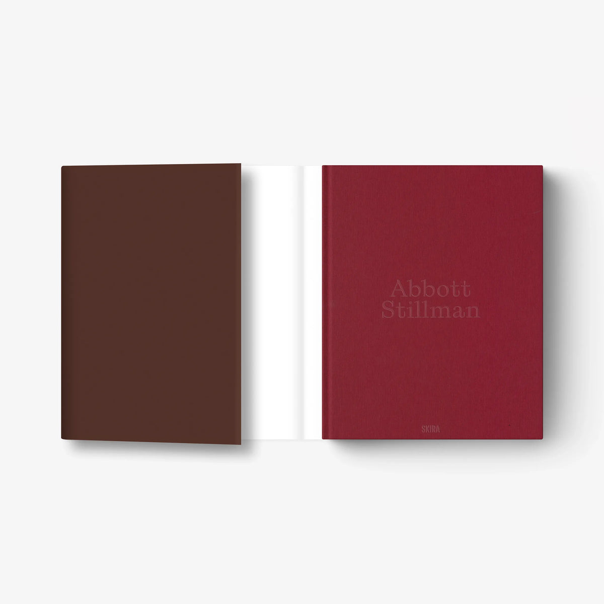Art book with brown and burgundy covers, title text on right cover