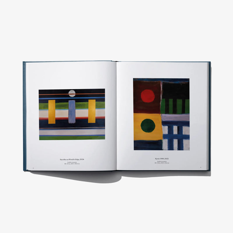 Art book open spread with two abstract artworks and small printed captions