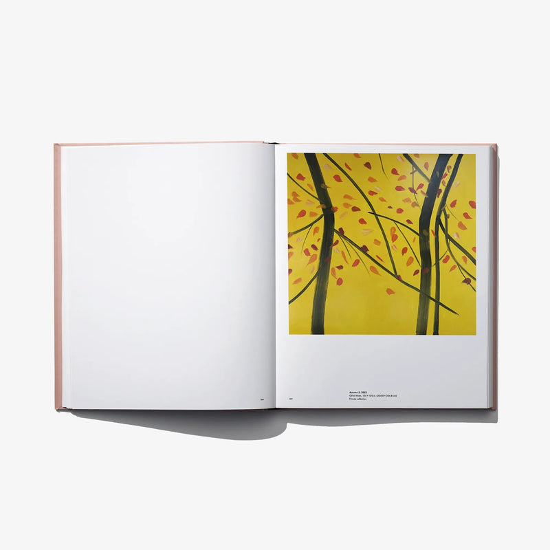 Open art book spread with blank left page and yellow tree artwork on right