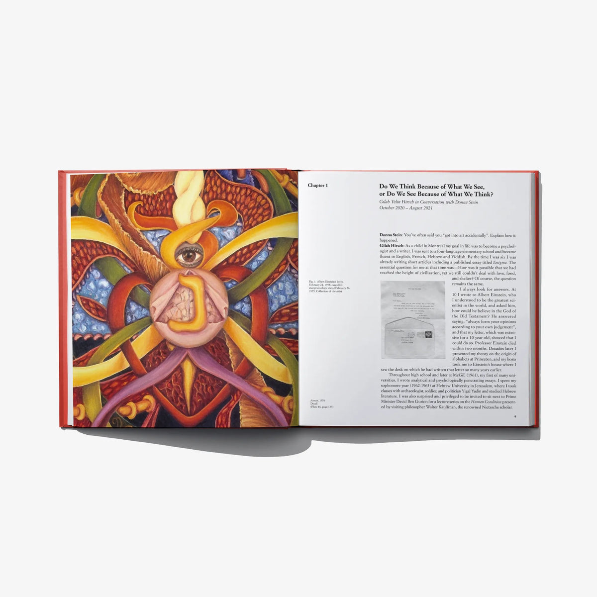 Hardcover book open spread with colorful artwork and printed text columns