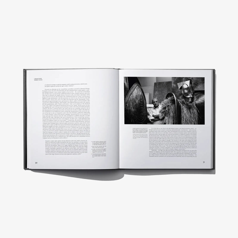 Open hardcover book showing two-page text and black-and-white portrait photograph