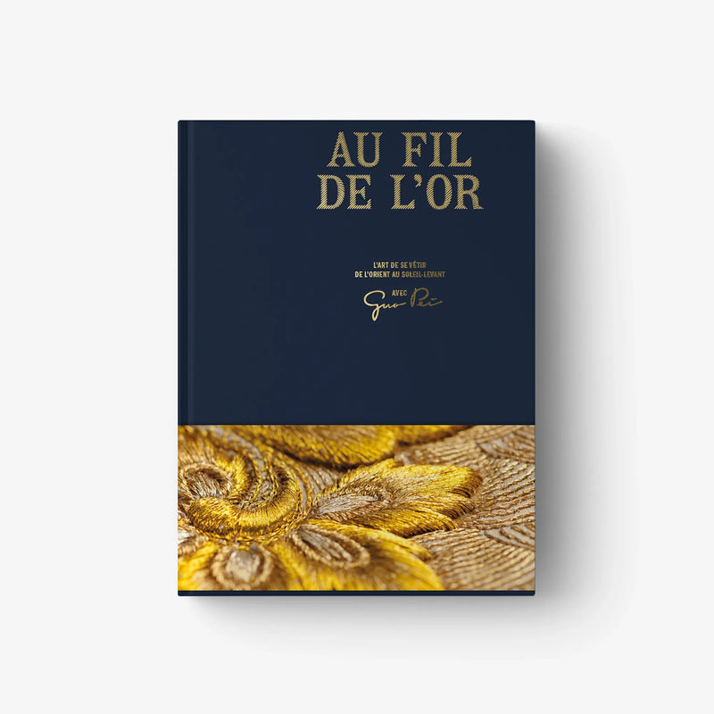 Au Fil de L'Or hardcover book cover with gold embroidery close-up