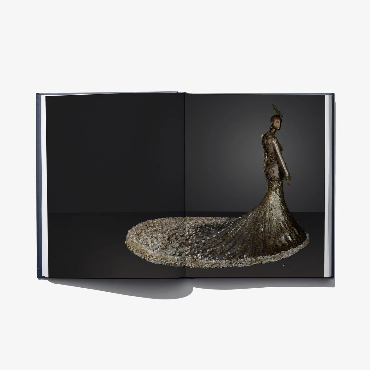Open Au Fil de L'Or book page: gold embroidered gown with flared skirt