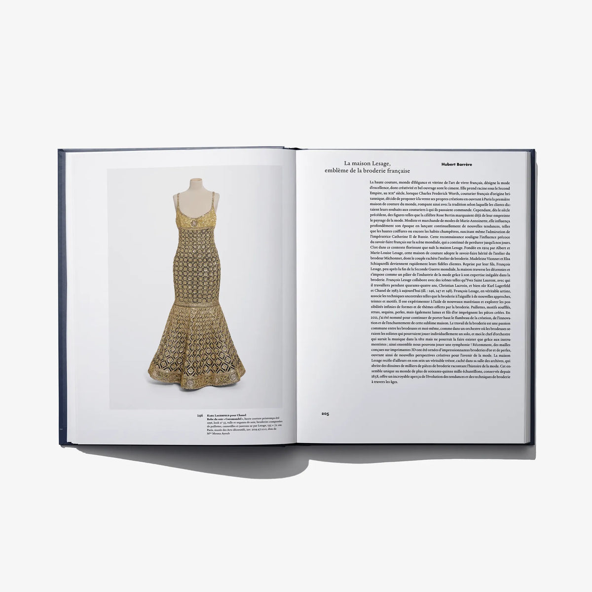 Open Au Fil de L'Or book page: gold patterned sleeveless dress on mannequin