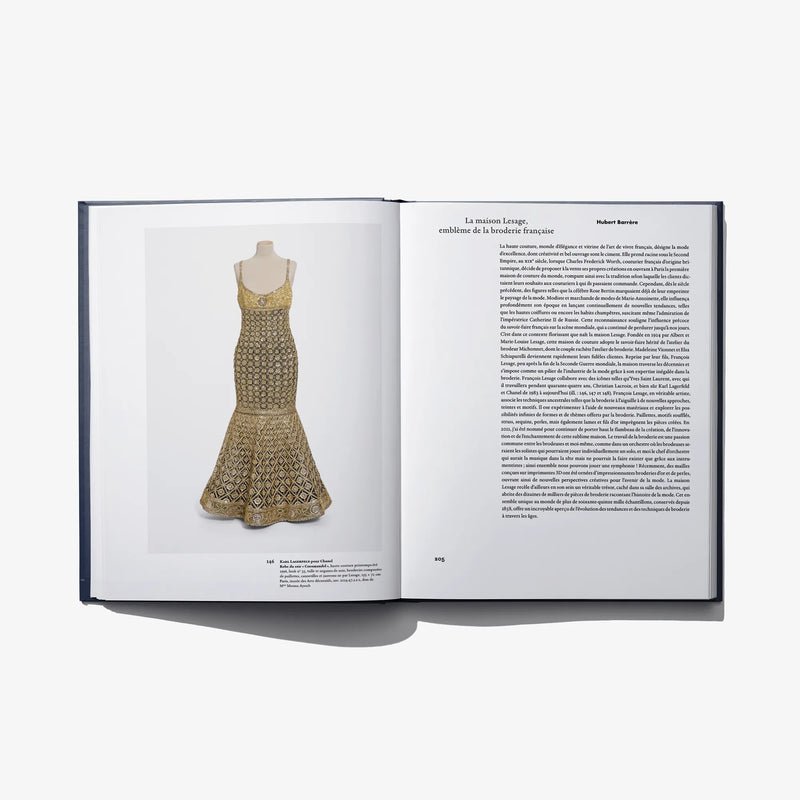 Open Au Fil de L'Or book page: gold patterned sleeveless dress on mannequin