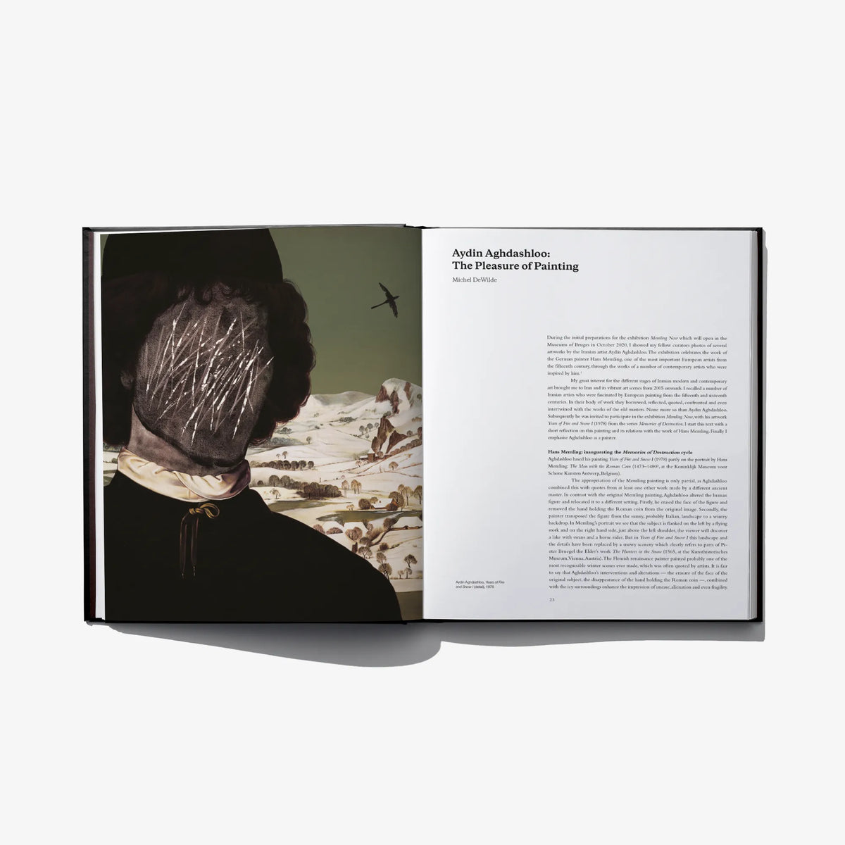Open art book spread with a seated figure painting image and a text page