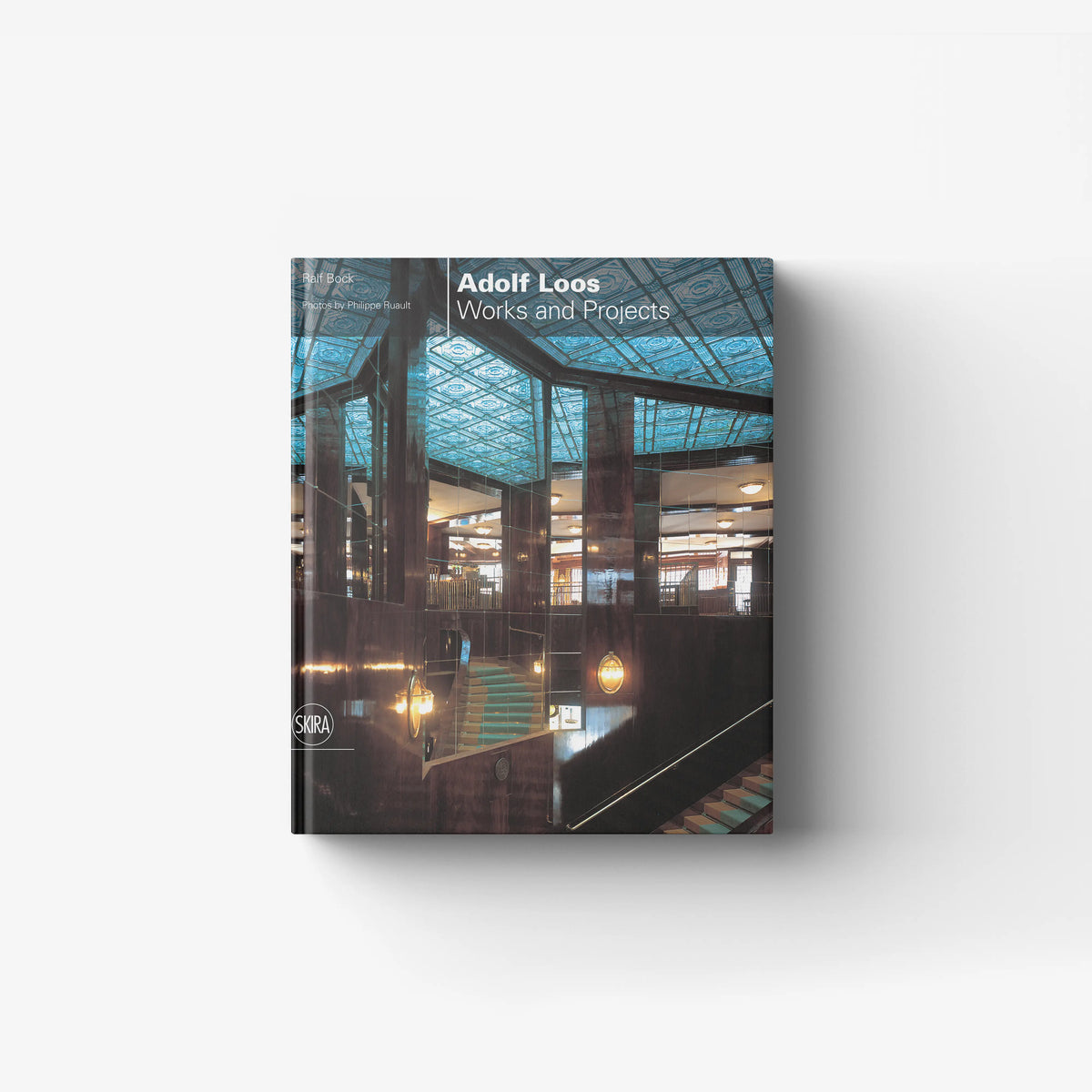 Architecture monograph book by Skira Arte with blue patterned cover and previously unpublished photographic documentation