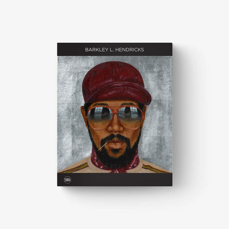 Framed portrait print of a man with a red cap and round blue-tinted glasses