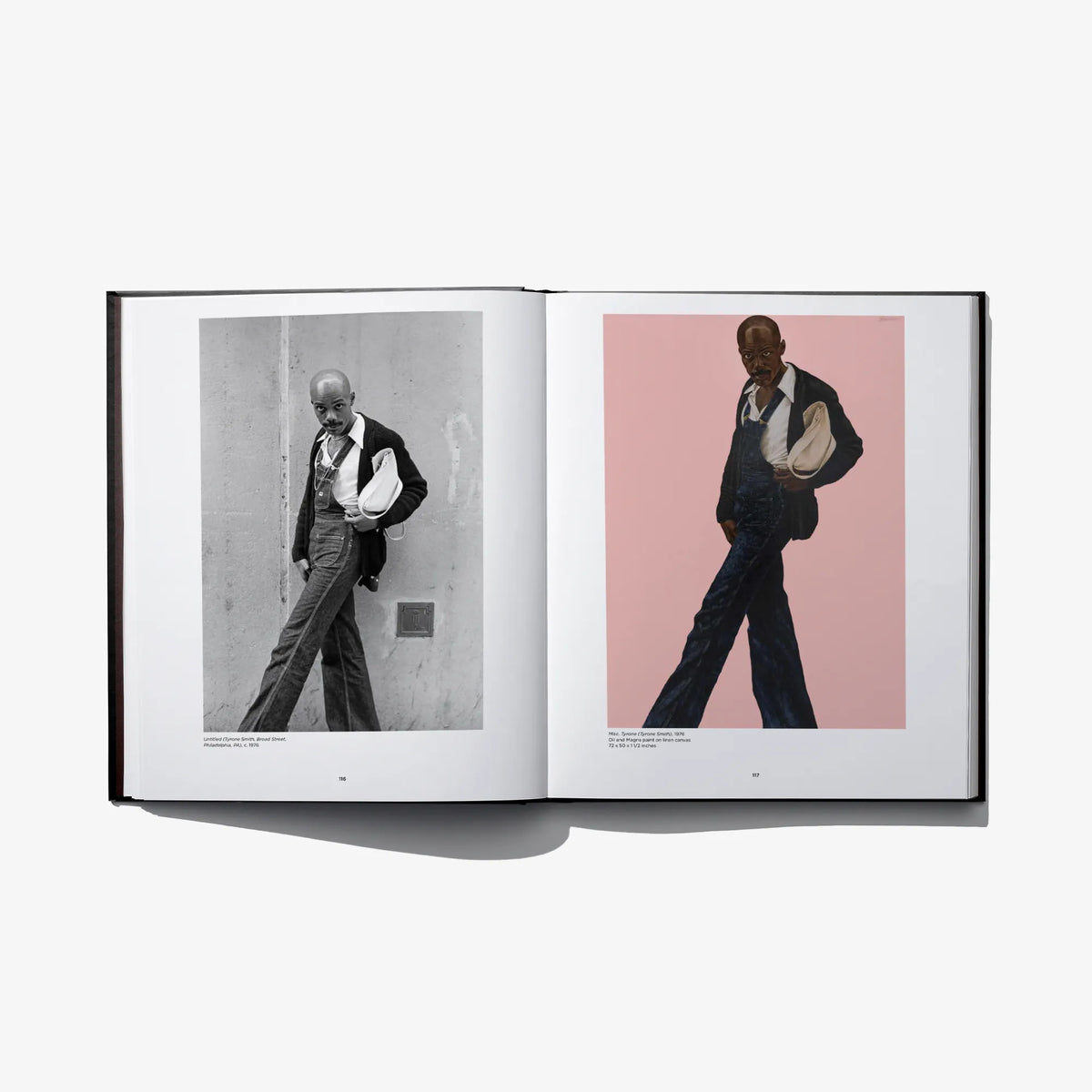 Open photo art book spread with two walking men, one black-and-white and one colored