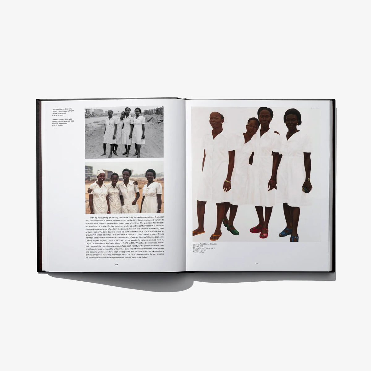 Open photo art book spread with group photos in white outfits and four figures