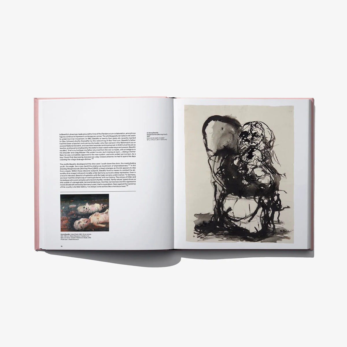 Open art book spread with large black line drawing artwork on right page