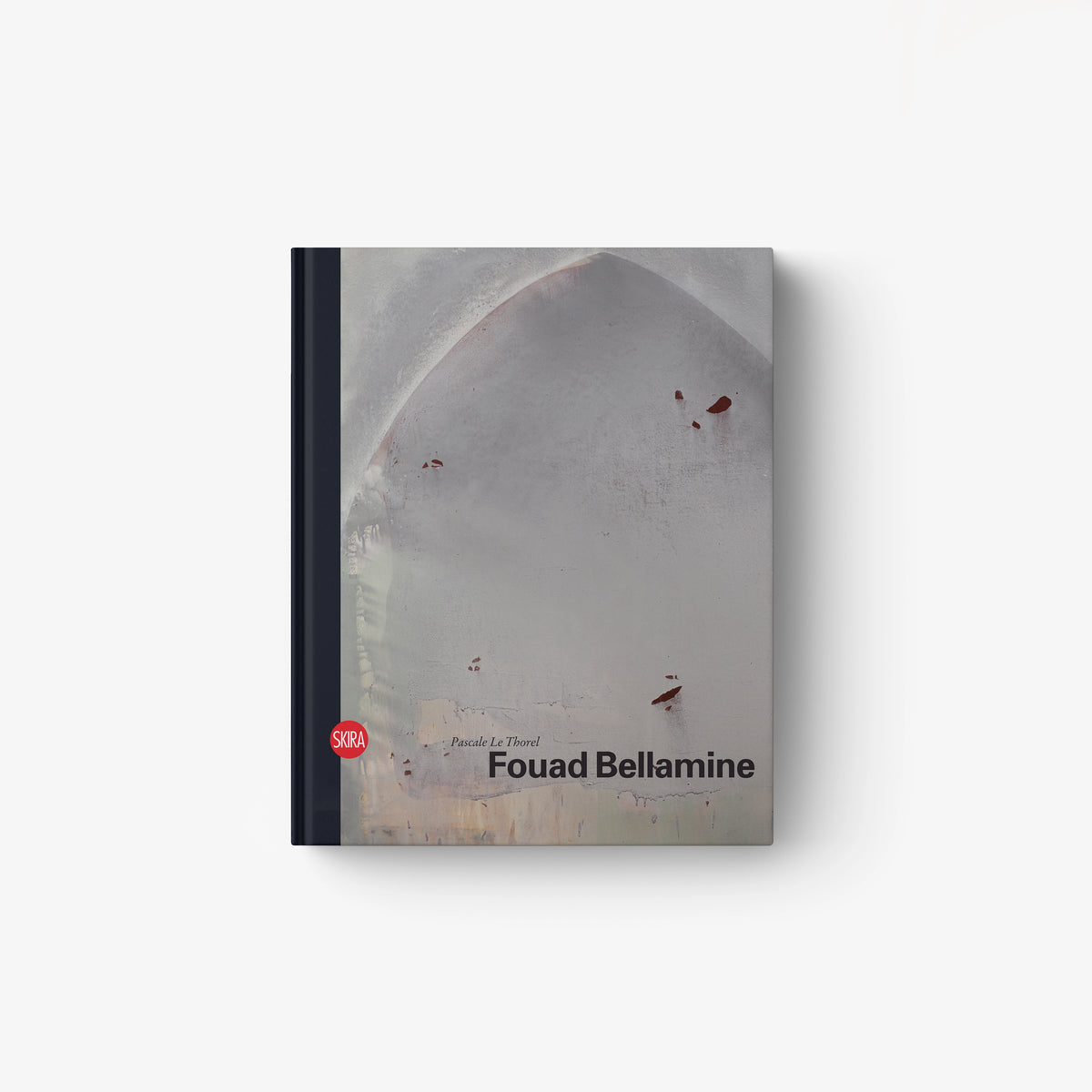Hardcover book with gray abstract cover and red accents, titled Fouad Bellamine