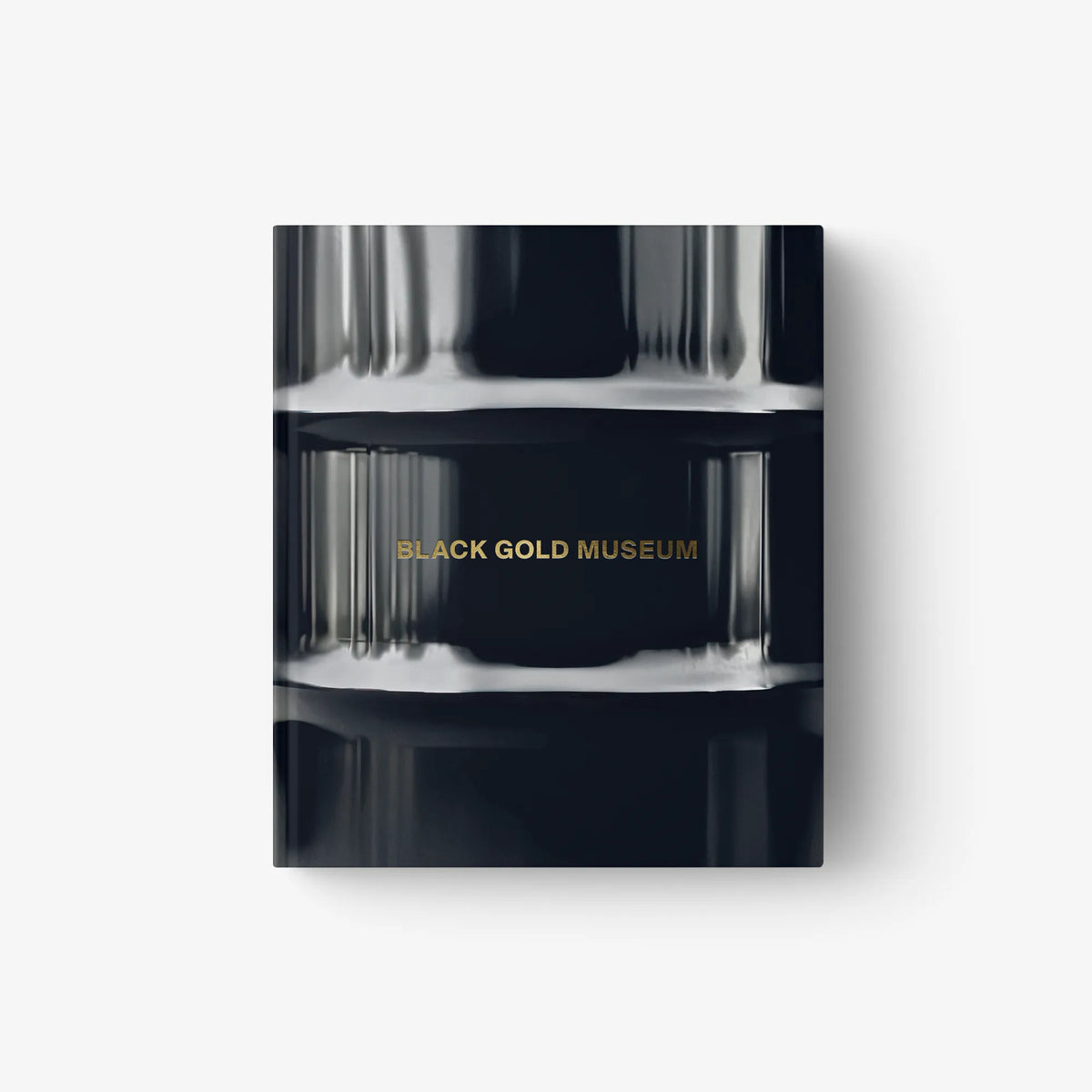 Hardcover art book cover with metallic blue-black finish and gold “BLACK GOLD MUSEUM” text