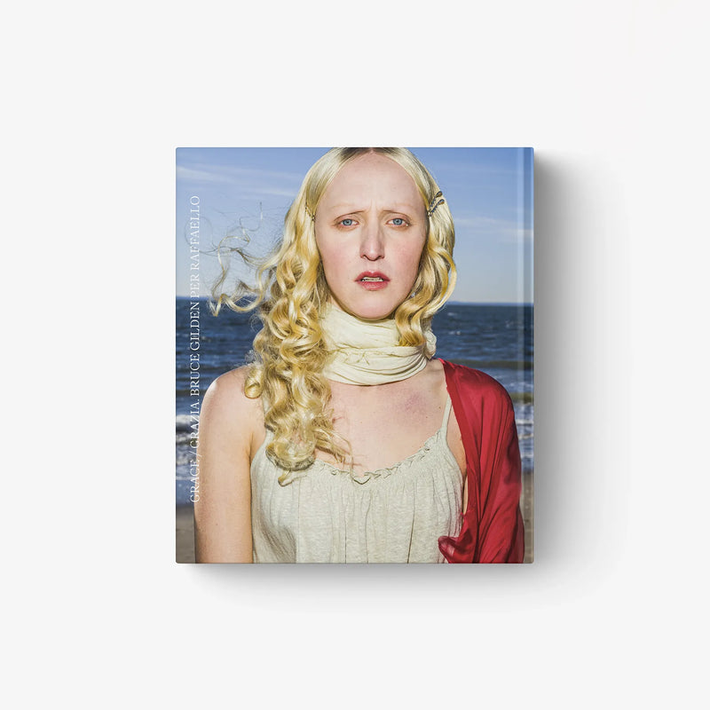 Photo book cover with blonde woman in scarf and light dress, red overlay
