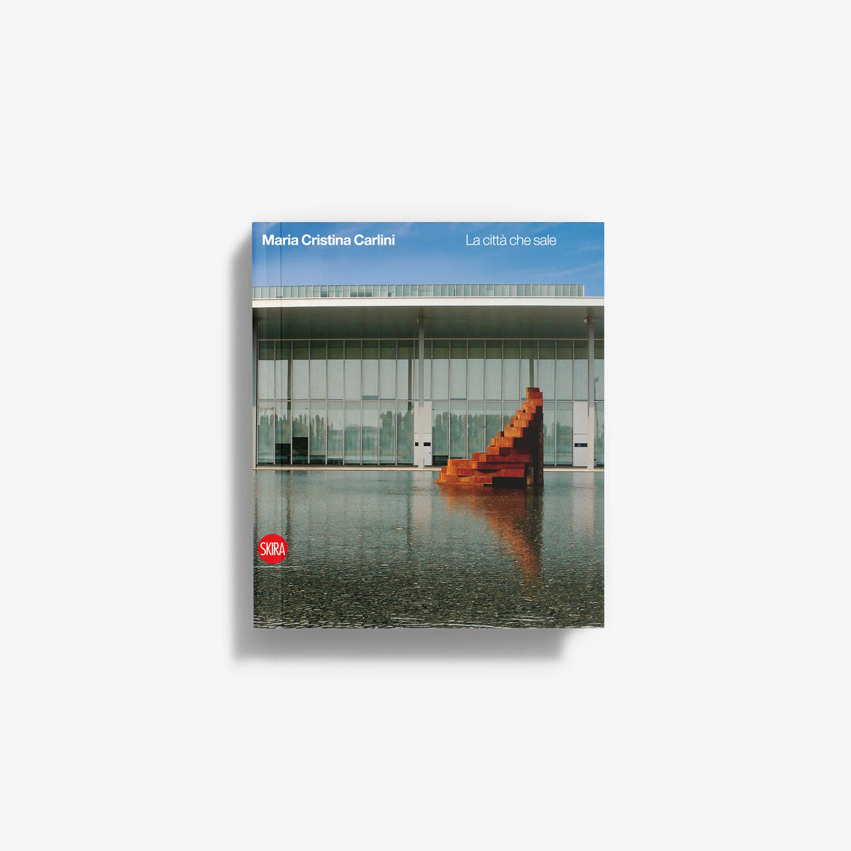 Paperback book cover with blue sky and modern building, featuring red staircase