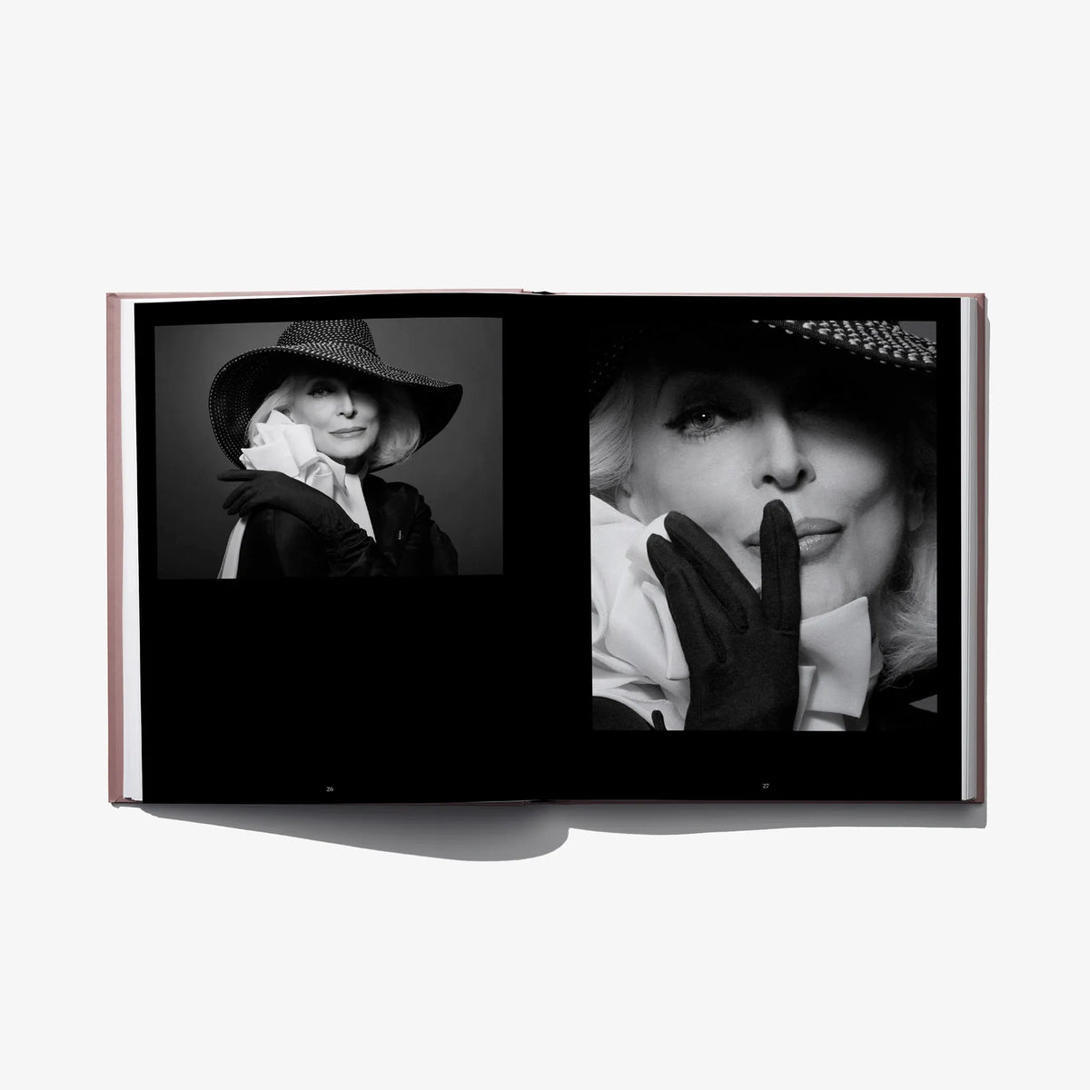 Open hardcover fashion book with close-up black-and-white model portraits