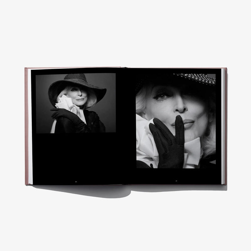 Open hardcover fashion book with close-up black-and-white model portraits