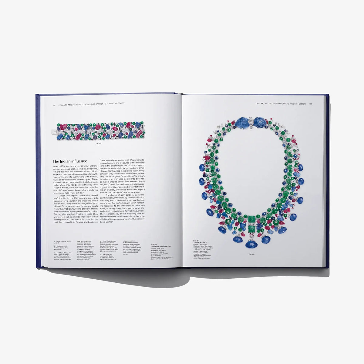 Open book featuring colorful beaded necklaces on the right and printed article text on the left