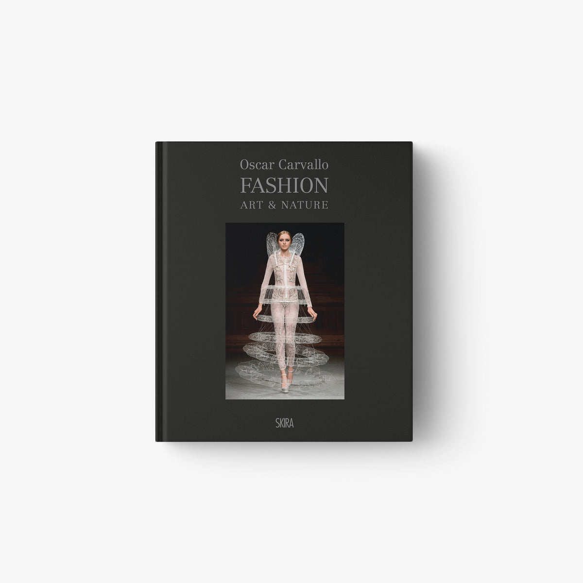 Hardcover fashion book with dark cover, model illustration, and Fashion Art & Nature title