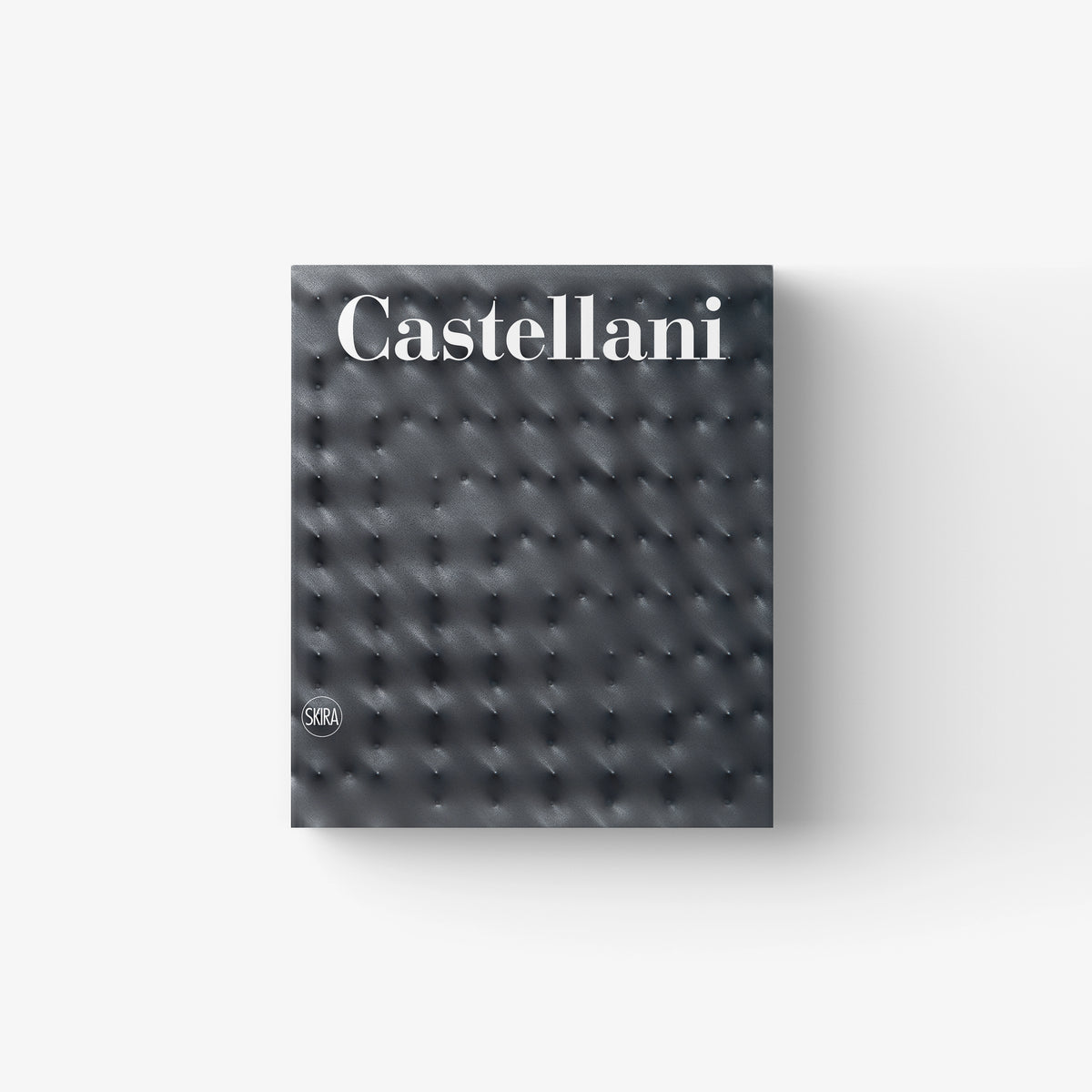 Catalogue raisonné book by Skira Arte, Enrico Castellani, dark grey leather effect cover with tufted buttons