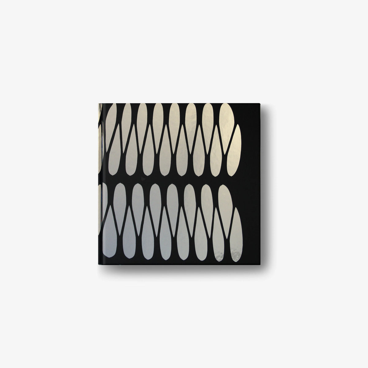Emilio Cavallini English edition book with black cover and cream abstract arch shapes