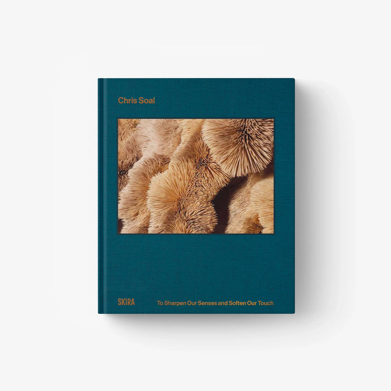 Teal art book with cover photo of close-up animal fur.
