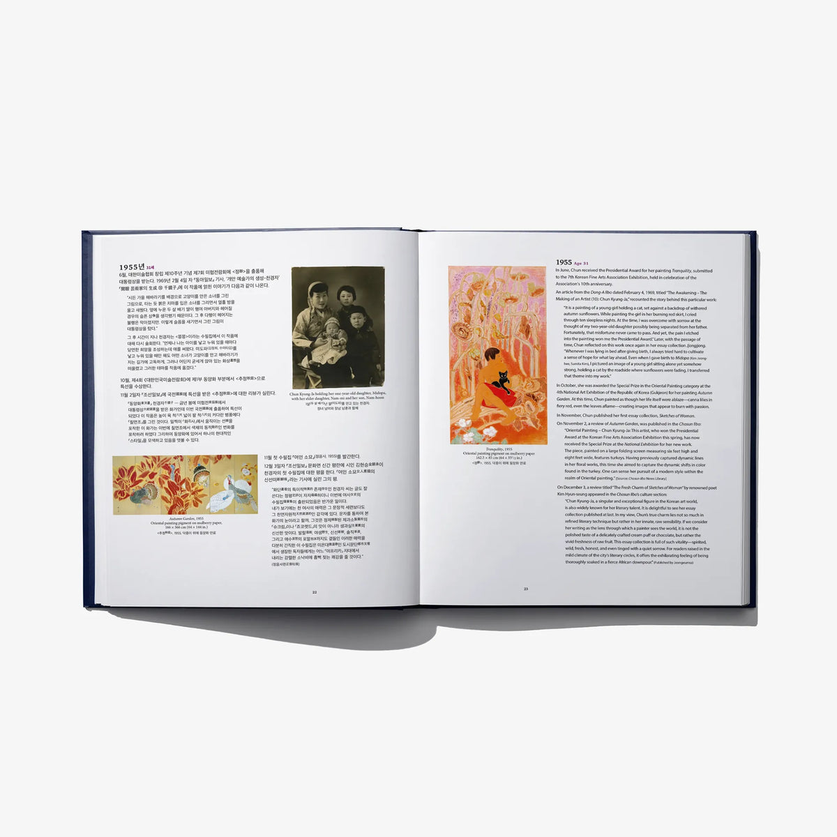 Open art book spread with photo and colorful artwork panels plus paragraphs of text
