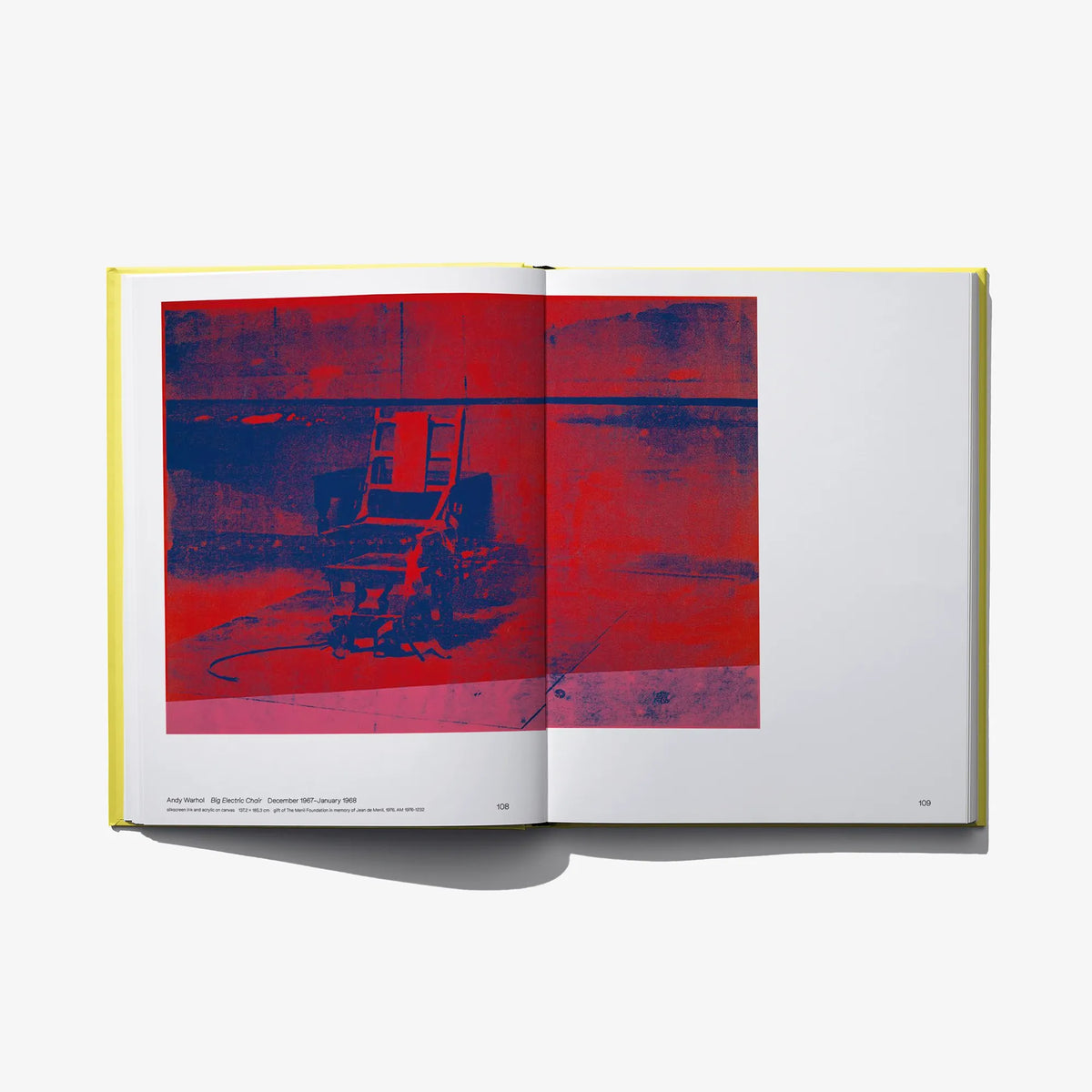 Open art book with red abstract artwork on left and blank right page