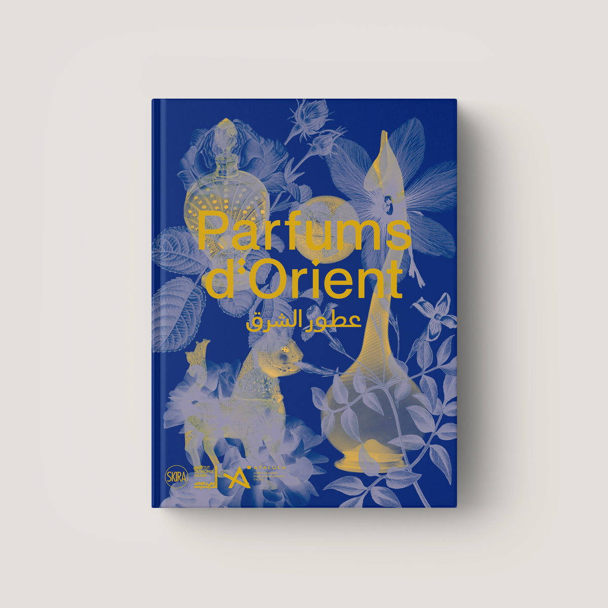 Blue hardcover book titled Parfums d'Orient with gold floral and ornamental illustrations on the cover.