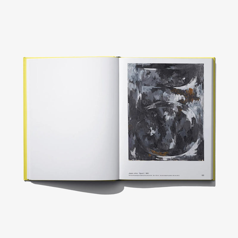 Open book with gray abstract painting on the right page and blank left page