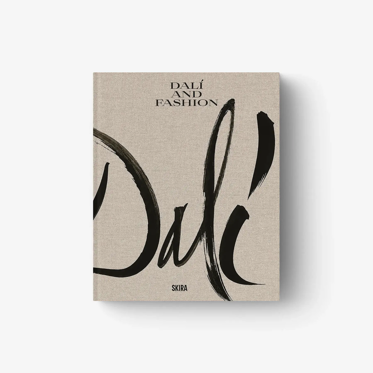 Dalí and Fashion book cover with beige linen texture and bold black brush lettering
