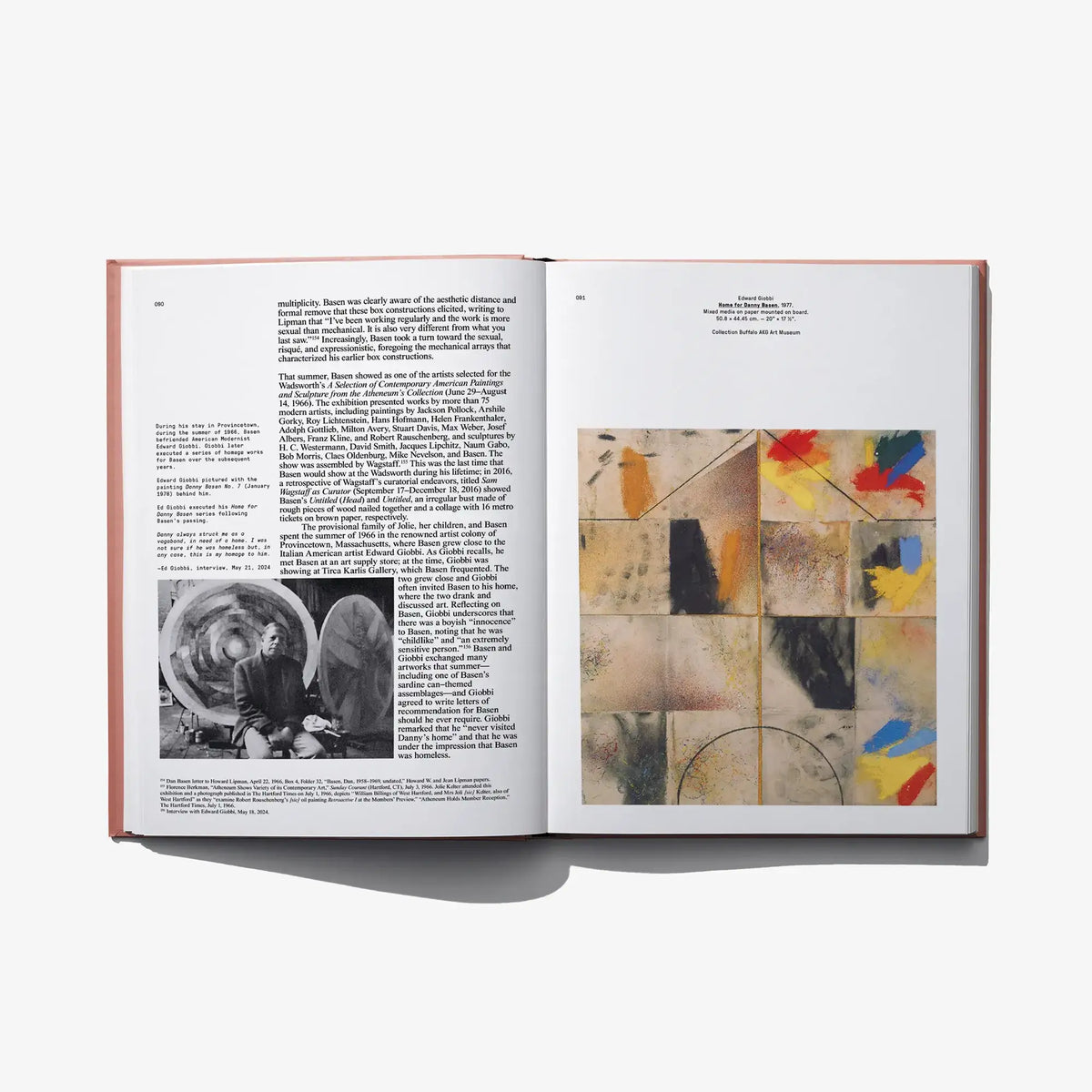 Open art book spread with text on left and colorful abstract artwork on right