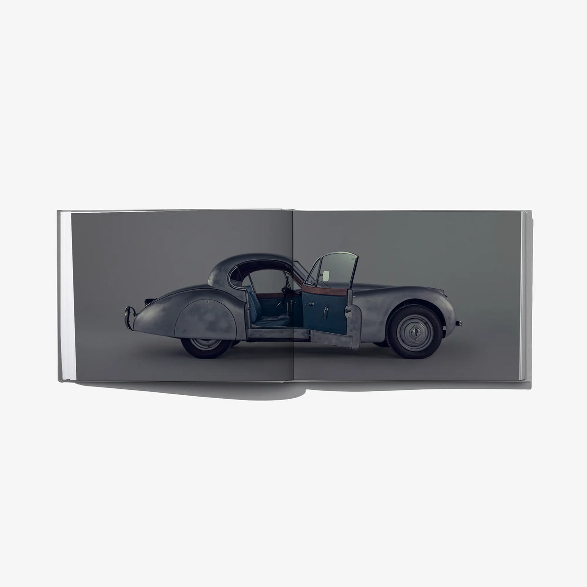 Dandy Crush book page with side-view photo of classic car