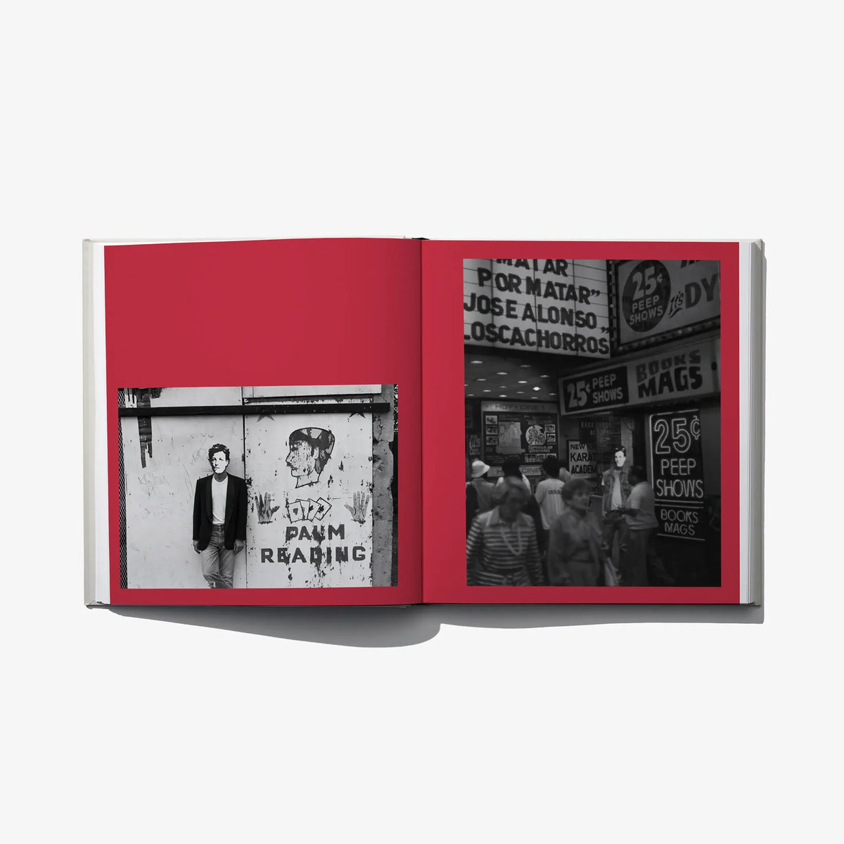 Open photo book spread with two black-and-white street photos on red page