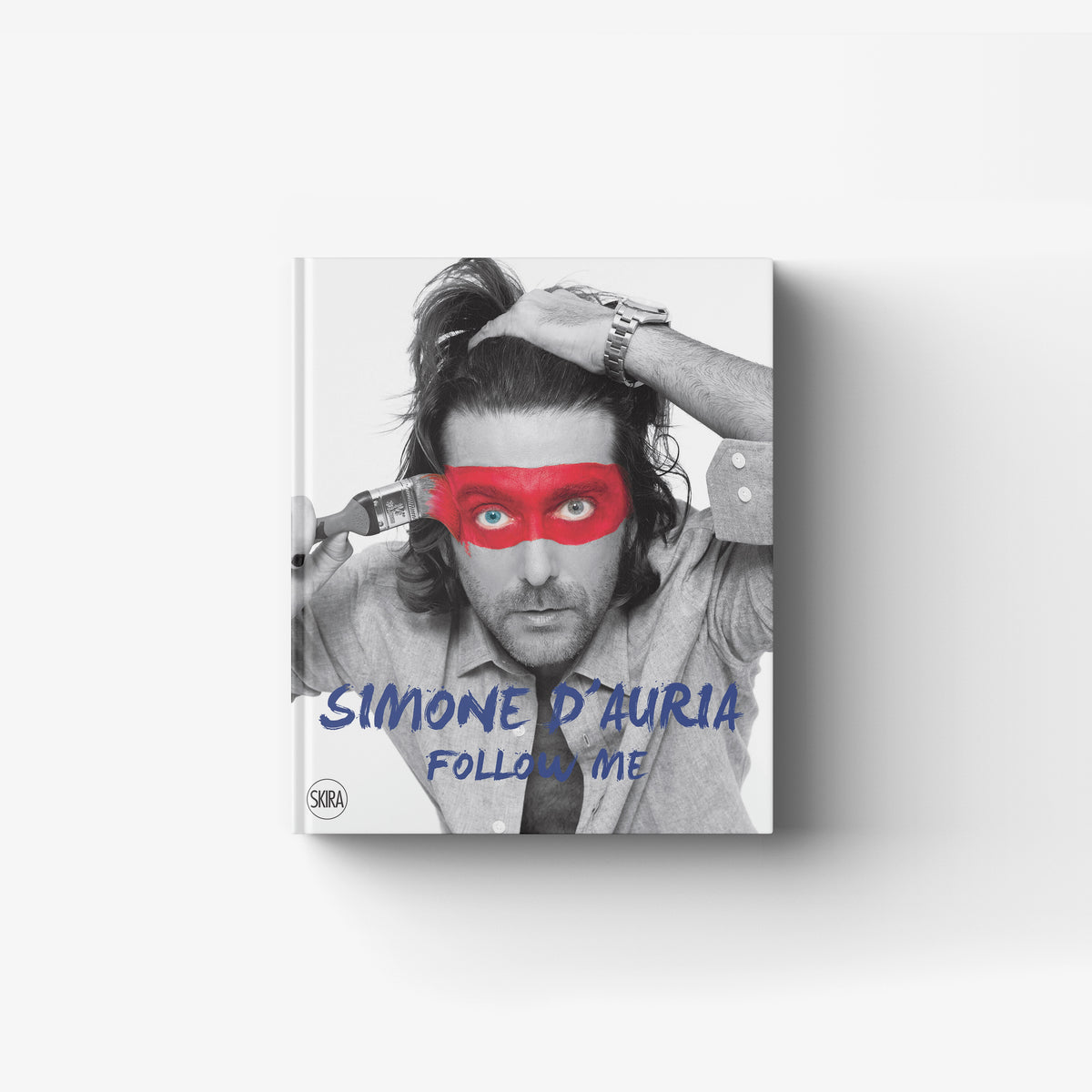 Contemporary art book cover by Skira Arte featuring Simone D'Auria, black and white portrait with red eye mask