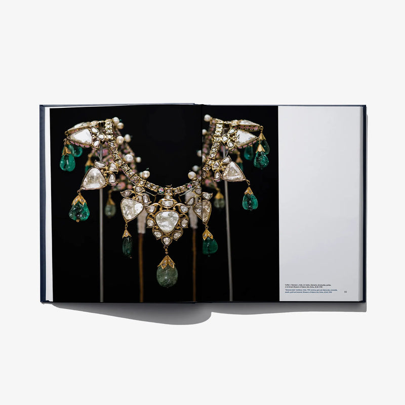 Diamonds of Golconda open book showing jeweled necklace on black page
