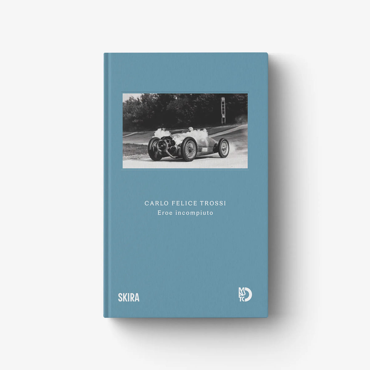 Blue hardcover book with mounted photo and title on front cover