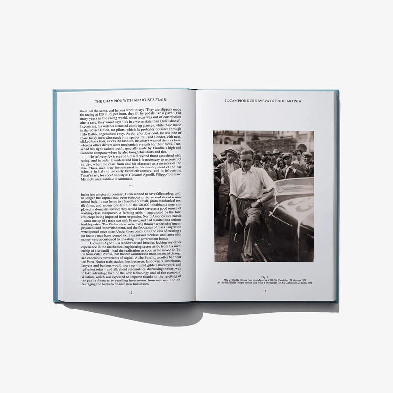 Open book spread with black text columns and one black-and-white photo
