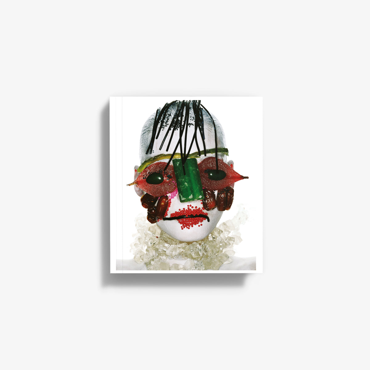 Softcover fashion art book with colorful face mask collage cover