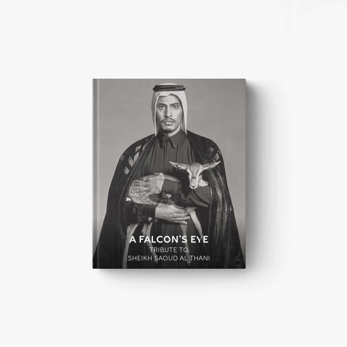 Monochrome portrait of Sheikh Saoud Al Thani holding a falcon, titled A Falcon’s Eye book cover.
