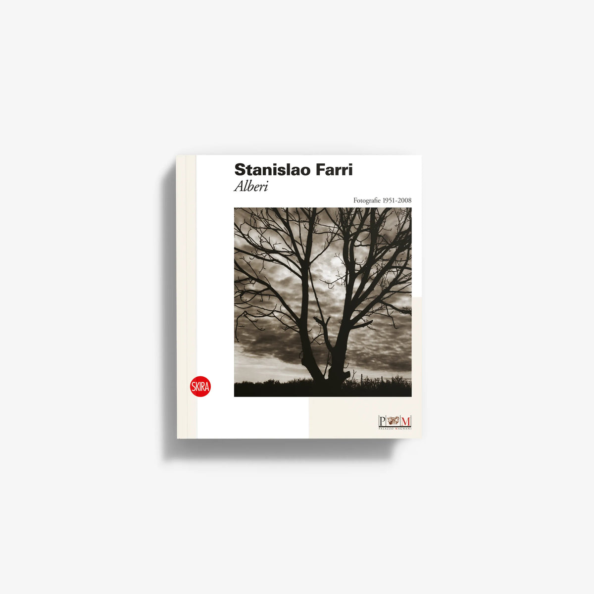 Photo book cover with tree landscape, cream border, title and author text