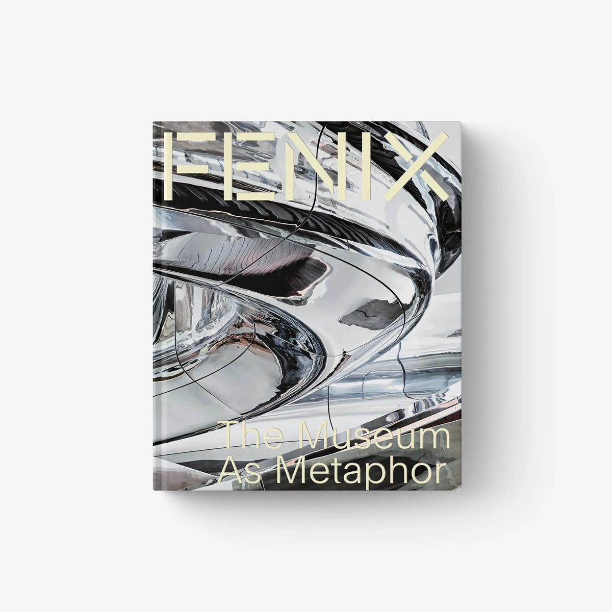Architecture book with chrome-style abstract cover art and 'The Museum As Metaphor' text.