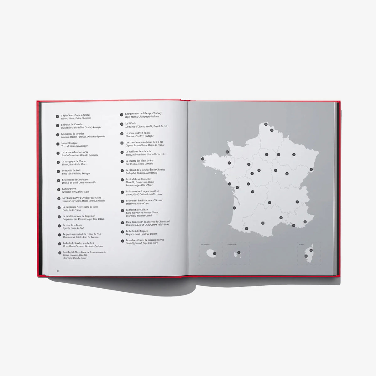 Open book spread with gray map of France and labeled points