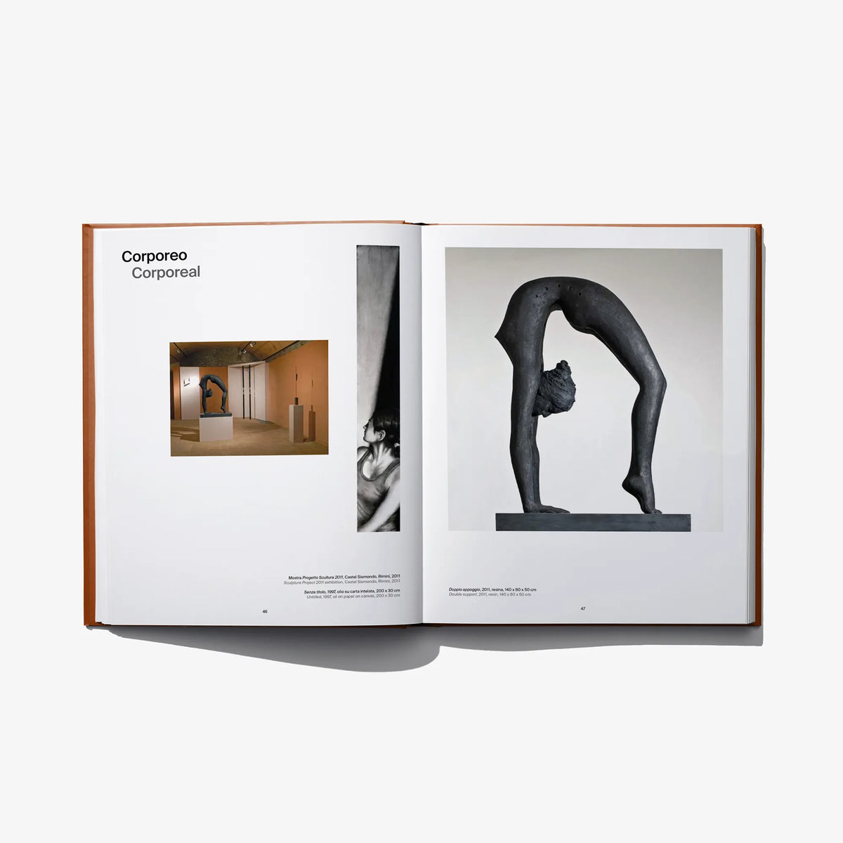 Open art book spread with dark sculptural figure and small room thumbnail